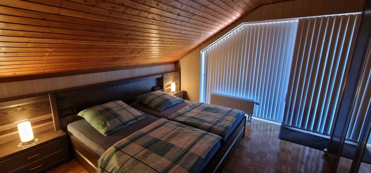 Schlafzimmer mit Balkon